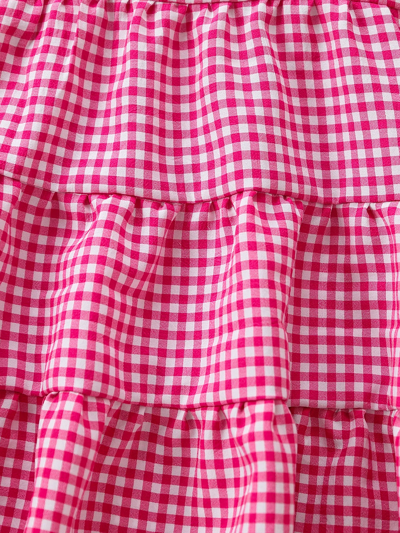 Robe d'été pour bébé fille rose à carreaux vichy, bretelles à nœud, volants superposés, coupe trapèze, idéale pour les fêtes et les occasions spéciales. En polyester. – Image 4